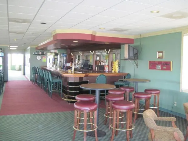 table with stools around the bar